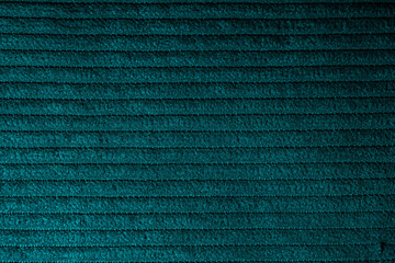 Closeup of turquoise corduroy cloth as patterned textured background