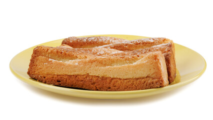 Several delicious crispy cookies lying on a yellow plate isolated on a white background.