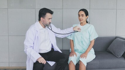 doctor uses stethoscope to listen heartbeat patient 