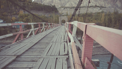 Ancient wooden bridge who believes that two sides give life a place to travel