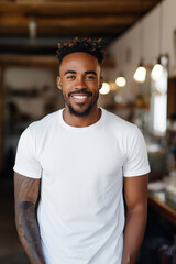 A Black man wearing a plain white T-shirt
