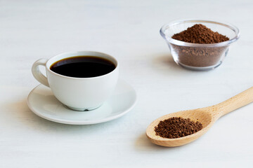 white cup of Chicory black coffee and ground chicory root isolated on a white background. Healthy herbal drink. coffee substitute. Copy space.
