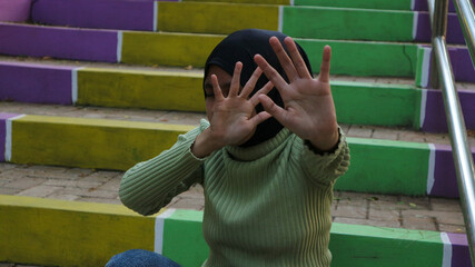young female person crossed her hand for stop violence, sexual abuse, domestic violence and rape