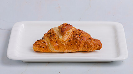 Croissant on plate isolated