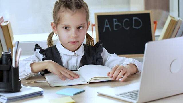 Tired child doesn't want to study. Annoyed pupil tired showing caprice emotion