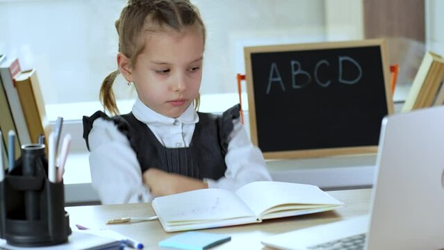 Tired child doesn't want to study. Annoyed pupil tired showing caprice emotion