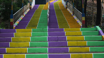 colorful stairs at city park. colorful wall background.