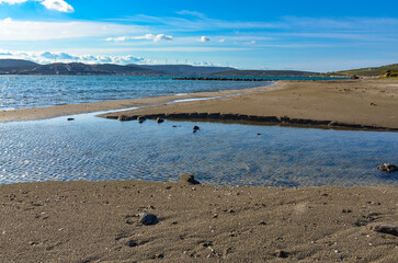 sand beach on Yumru Koyu Bay coast in Alacati (Izmir province, Turkey)	