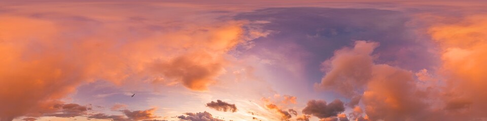 Sunset sky panorama with bright glowing pink Cumulus clouds. HDR 360 seamless spherical panorama....
