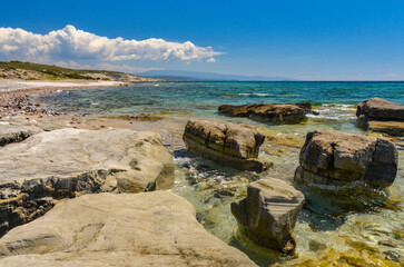 reefs and crystal clear water of Aegean Sea on Gilikli beach near Alacati (Cesme, Izmir province,...