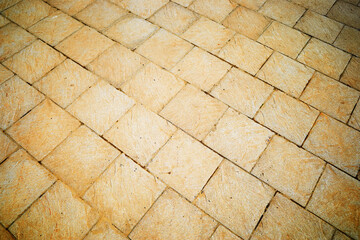 Diagonal brown street tiles texture background