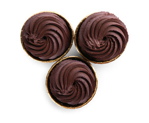 Delicious chocolate cupcakes isolated on white, top view