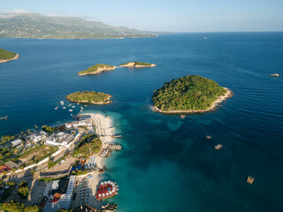 Aerial view of empty beach and turquoise waters in Ksamil, Sarande, Albania.