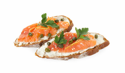 Tasty canapes with salmon, capers and cream cheese isolated on white