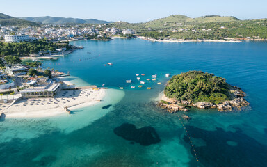 Aerial view of empty beach and turquoise waters in Ksamil, Sarande, Albania.