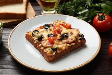 Tasty pizza toast and products on wooden table