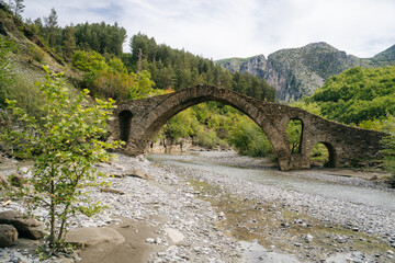 Fototapeta na wymiar The Old Mes bridge near Shkoder. Albania, Europe. Ottoman stone arch bridge Ura e Kadiut