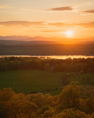 Sunset view over the Hudson River from the fire tower on Mount Rutsen, in Ferncliff Forest, Rhinebeck, New York