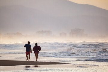 Couple on the beach of Oliva