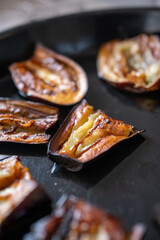 baked and sliced eggplants close-up