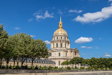 Fototapeta na wymiar Exterior facade of Hôtel National des Invalides, French architectural complex from the 17th century, located in the seventh district of Paris, 400 meters from the Military School and The Army Museum