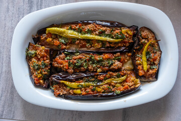 Karniyarık with minced meat and eggplant, a Turkish traditional dish, on a oval serving plate