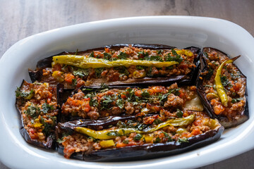 Karniyarık with minced meat and eggplant, a Turkish traditional dish, on a oval serving plate