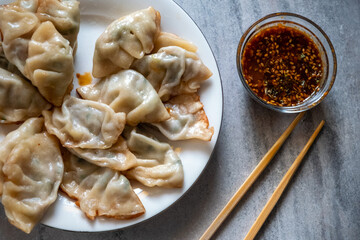 Serving Gyoza dumplings, a local Chinese and Japanese common food