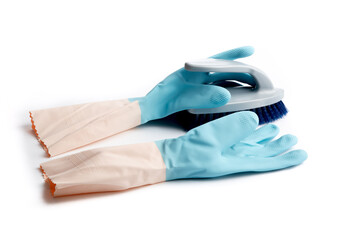 blue rubber gloves and a bristle brush ready for cleaning isolated on white