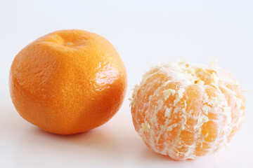 Mandarins on a white wooden background. Rich in nutrition, fiber, and vitamins. Picture design for...