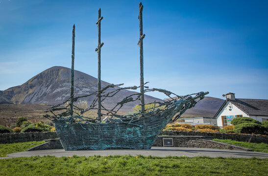 Skeletons on a sailing ship set against the Craiogh Patrick mountain