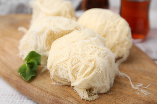 Eastern sweets. Tasty Iranian pashmak on white wooden table, closeup