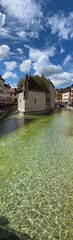 Annecy, Haute-Savoie, France, 04-21-2024: Palais de l'Ile, residence of the castellan of Annecy since12th century, built in the middle of the Thiou River, classified as Historic Monument of France