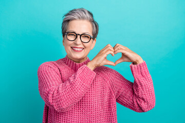 Photo of cheerful nice positive person dressed knitwear sweater in glasses hands showing heart...