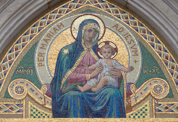 MILAN, ITALY - MARCH 7, 2024: The mosaic of Madonna on the facade of church Chiesa di Santa Maria del Suffragio by Spirito Maria Chiappetta (1927).