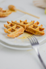 Waffle with honey. Aesthetic composition. Food Styling.