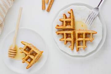 Waffle with honey. Aesthetic composition. Food Styling.