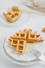 Waffle with honey. Aesthetic composition. Food Styling.