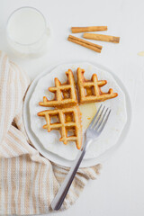 Waffle with honey. Aesthetic composition. Food Styling.