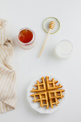 Waffle with honey. Aesthetic composition. Food Styling.