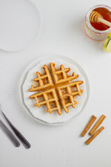 Waffle with honey. Aesthetic composition. Food Styling.