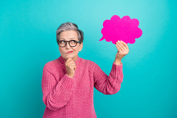 Portrait of pensive puzzled person wear knit pullover in eyewear look at mind cloud arm on chin isolated on turquoise color background