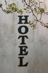 Hotel sign painted on a white wall