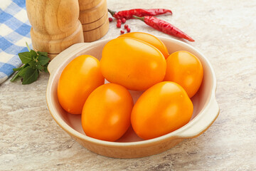 Sweet ripe yellow tomato in the bowl