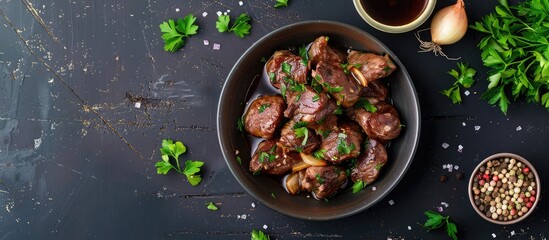 Chicken hearts served with parsley, onions, and soy sauce. Overhead view with space for text, flat lay image.