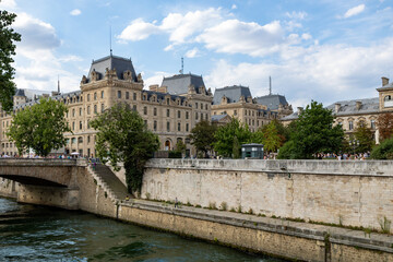 Traditional French architecture buildings and bridge along the Seine River promenade, boat ride. Paris, France.