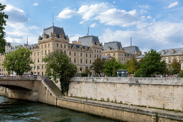 Traditional French architecture buildings and bridge along the Seine River promenade, boat ride. Paris, France.