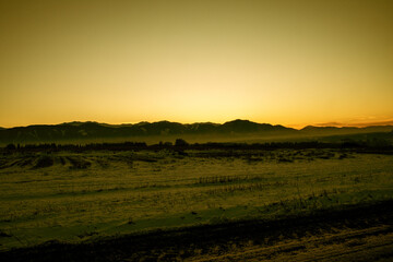 Fototapeta premium Sunset over mountains in winter season.