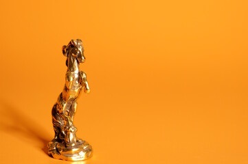 A statuette of a metal horse. Finance and economics.