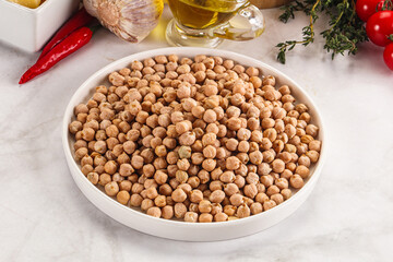 Dry chickpea seeds heap in the bowl